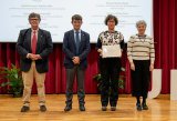 Professor Estela Rivas collecting the diploma